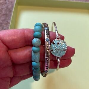 Three turquoise bracelets!! Two are stretch and one is a clip.